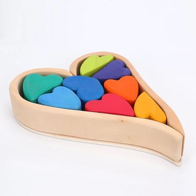 Arcobaleno di legno nordico di Jenga che impila le particelle elementari di legno naturali