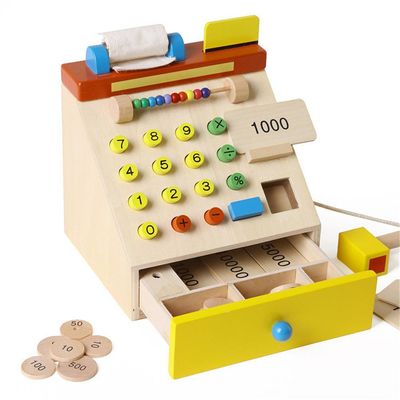 Il registratore di cassa di legno di simulazione dei bambini finge i giocattoli del gioco